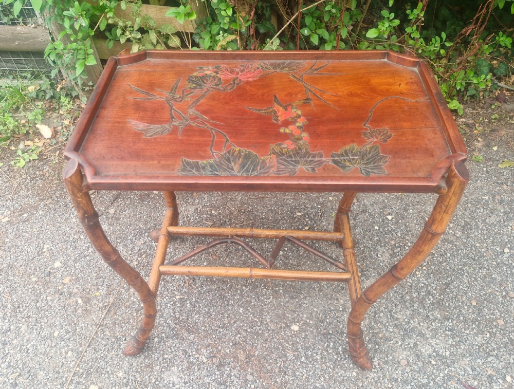 Carvef and decorated wooden Tray on bamboo stand View III