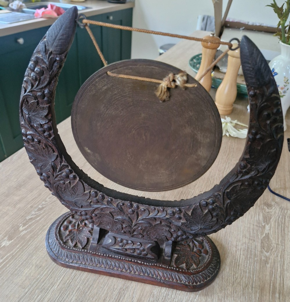Table top carved Anglo Indian dinner gong. View II