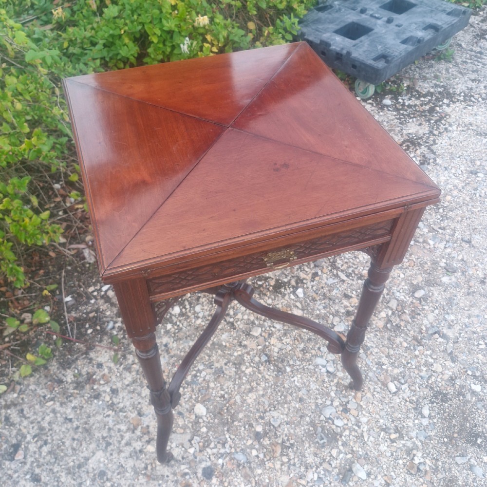 Edwardian mahogany envelope games table stamped Maples. View V