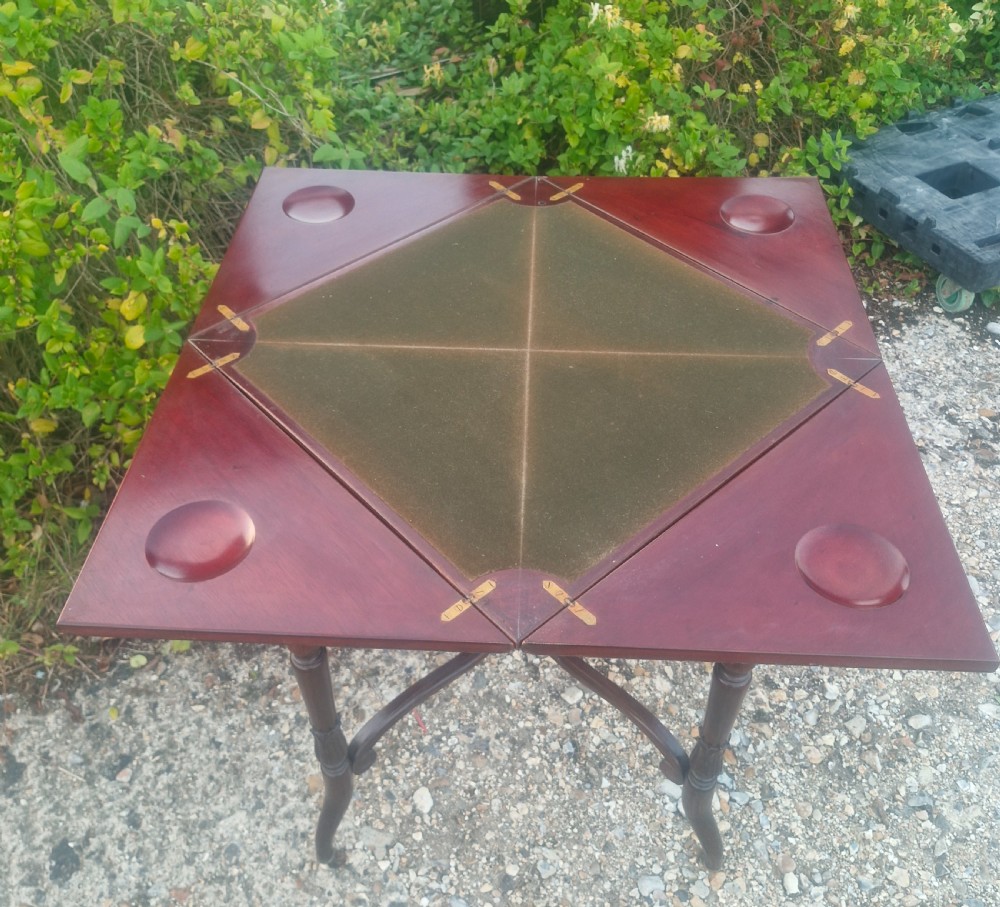 Edwardian mahogany envelope games table stamped Maples. View VII