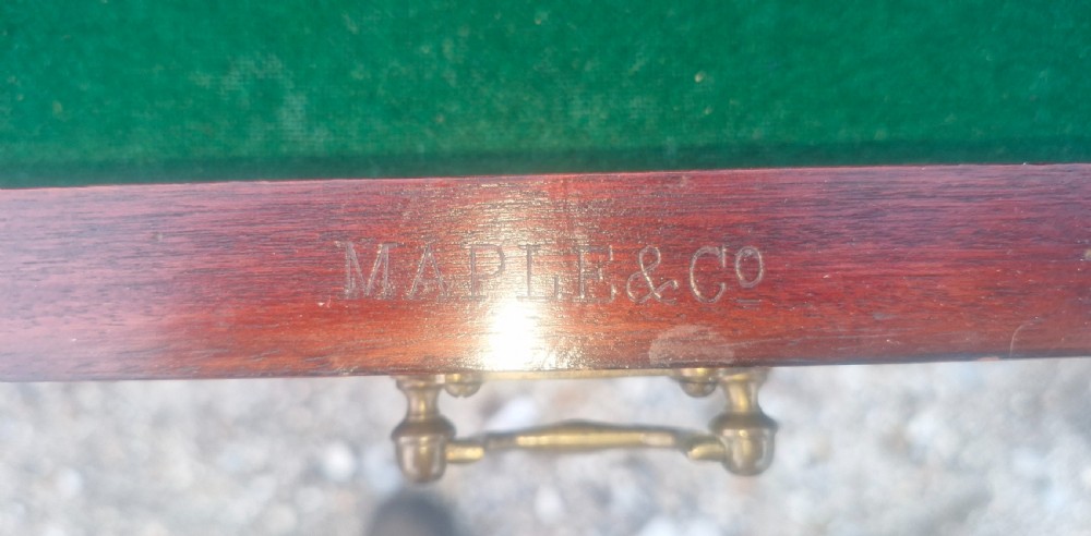 Edwardian mahogany envelope games table stamped Maples. View X