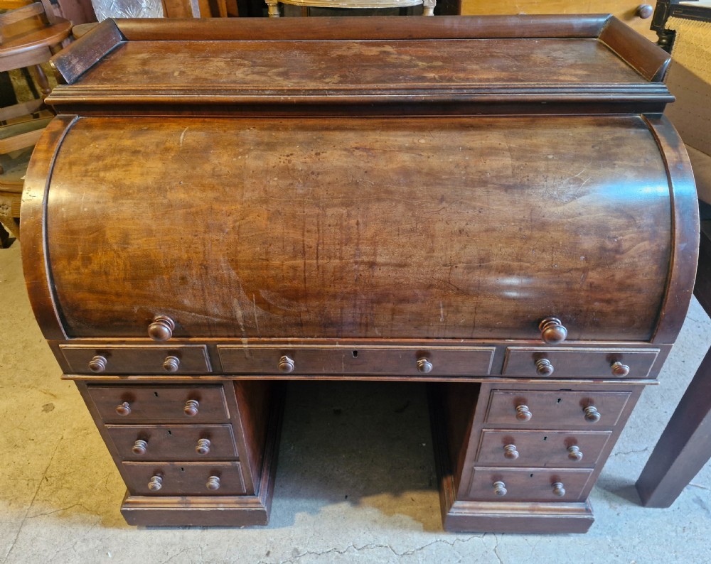 Mahogany free standing cylinder top pedestal desk. 
