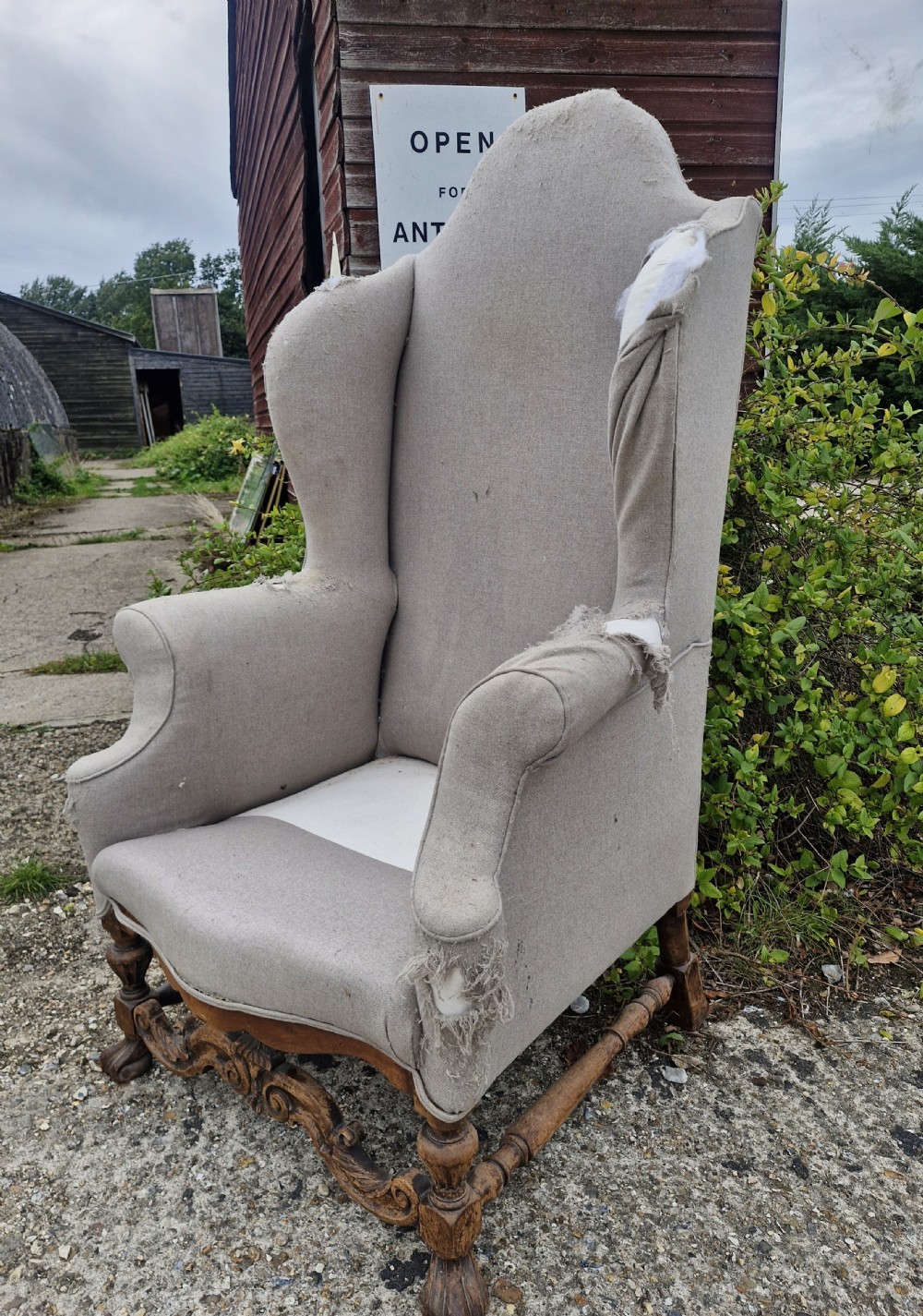 Tall wing back upholstered armchair for recovering.  View II