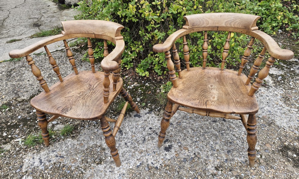 Pair of Late Victorian Smokers bow armchairs.
