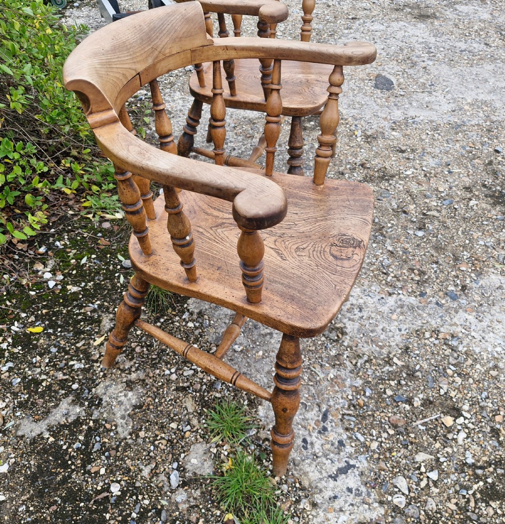 Pair of Late Victorian Smokers bow armchairs. View III