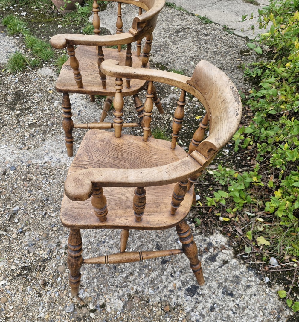 Pair of Late Victorian Smokers bow armchairs. View VII