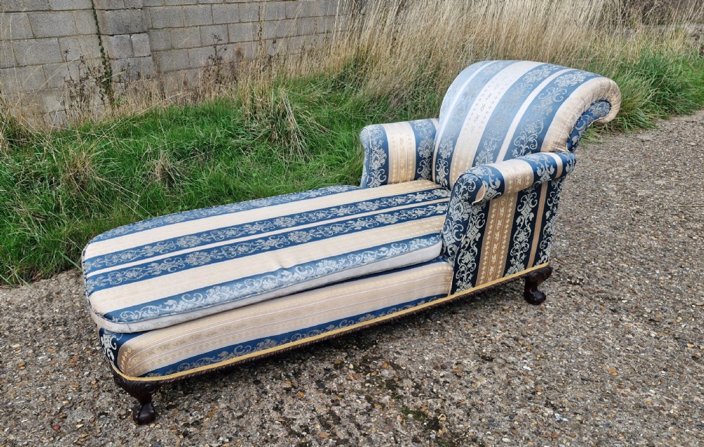 Edwardian carved Mahogany framed upholstered day bed.