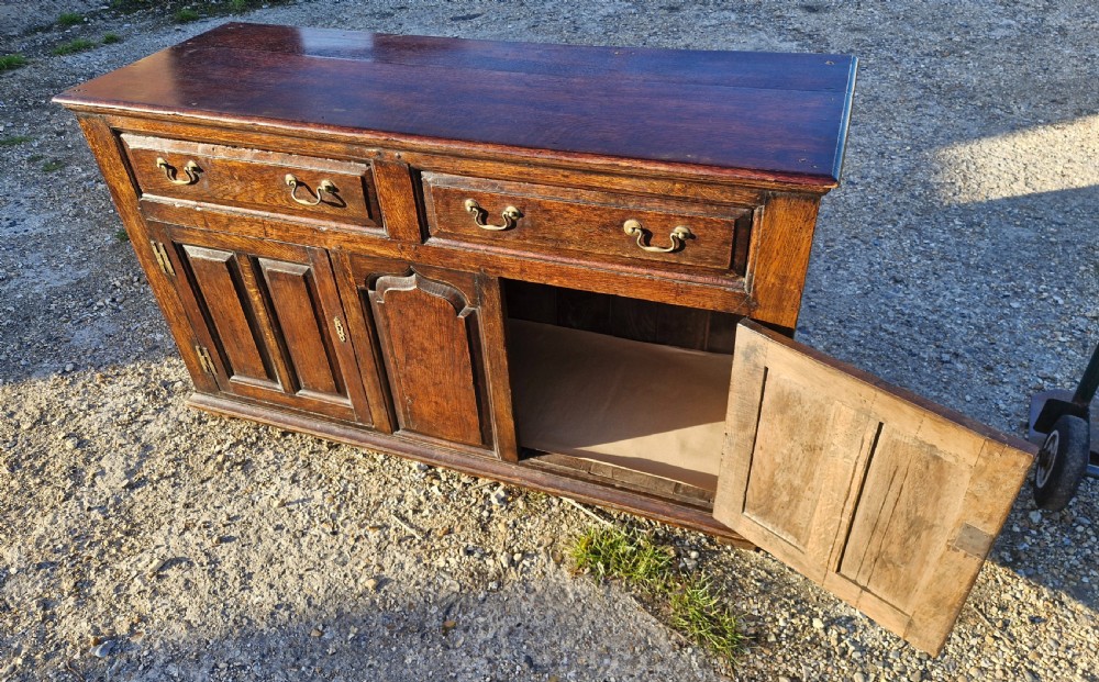 Antique panelled oak dresser base.  View III