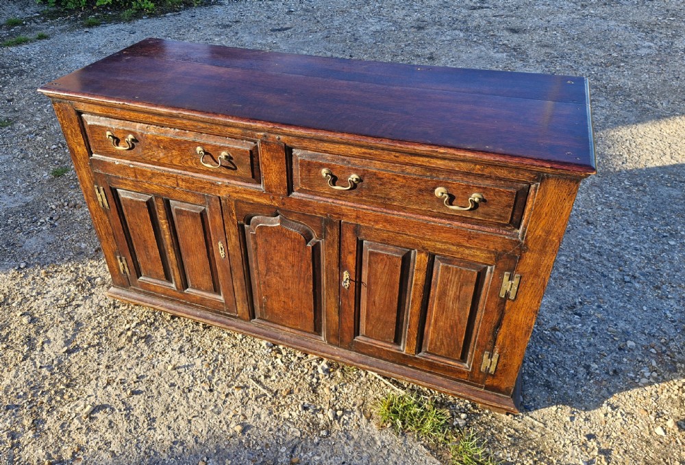 Antique panelled oak dresser base.  View IV