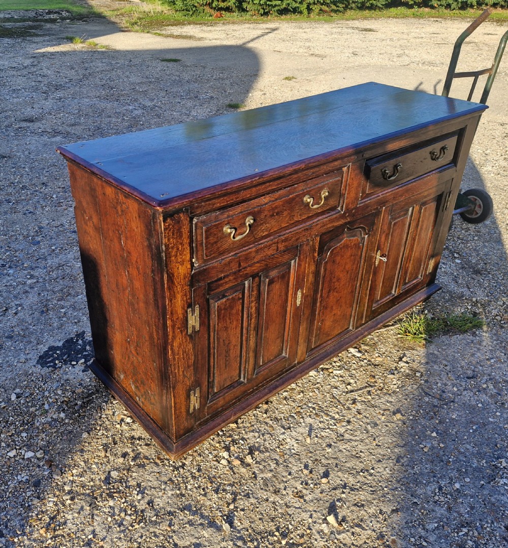 Antique panelled oak dresser base.  View V