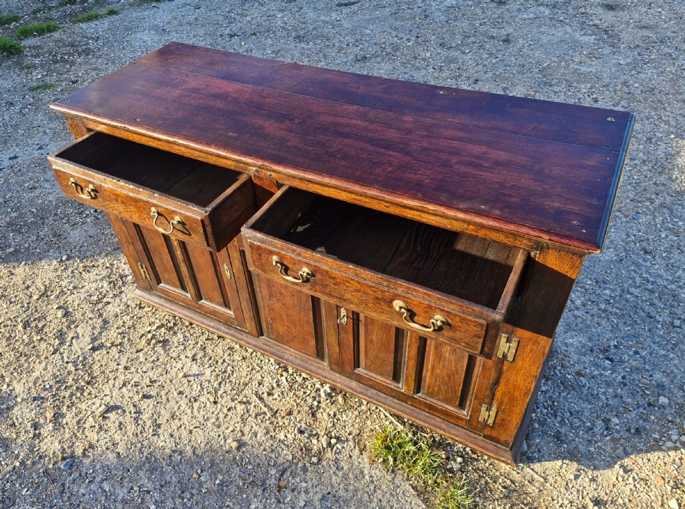 Antique panelled oak dresser base.  View VII