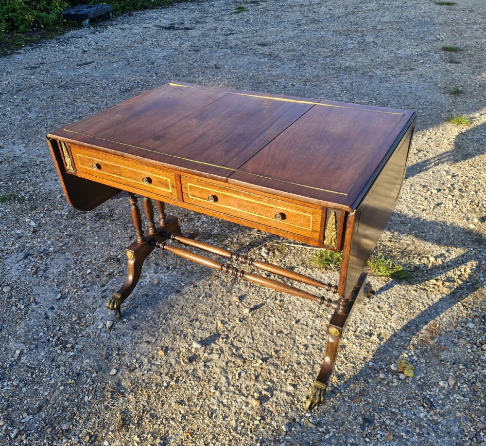 Early 20th century brass inlaid mahogany free standing sofa table. 