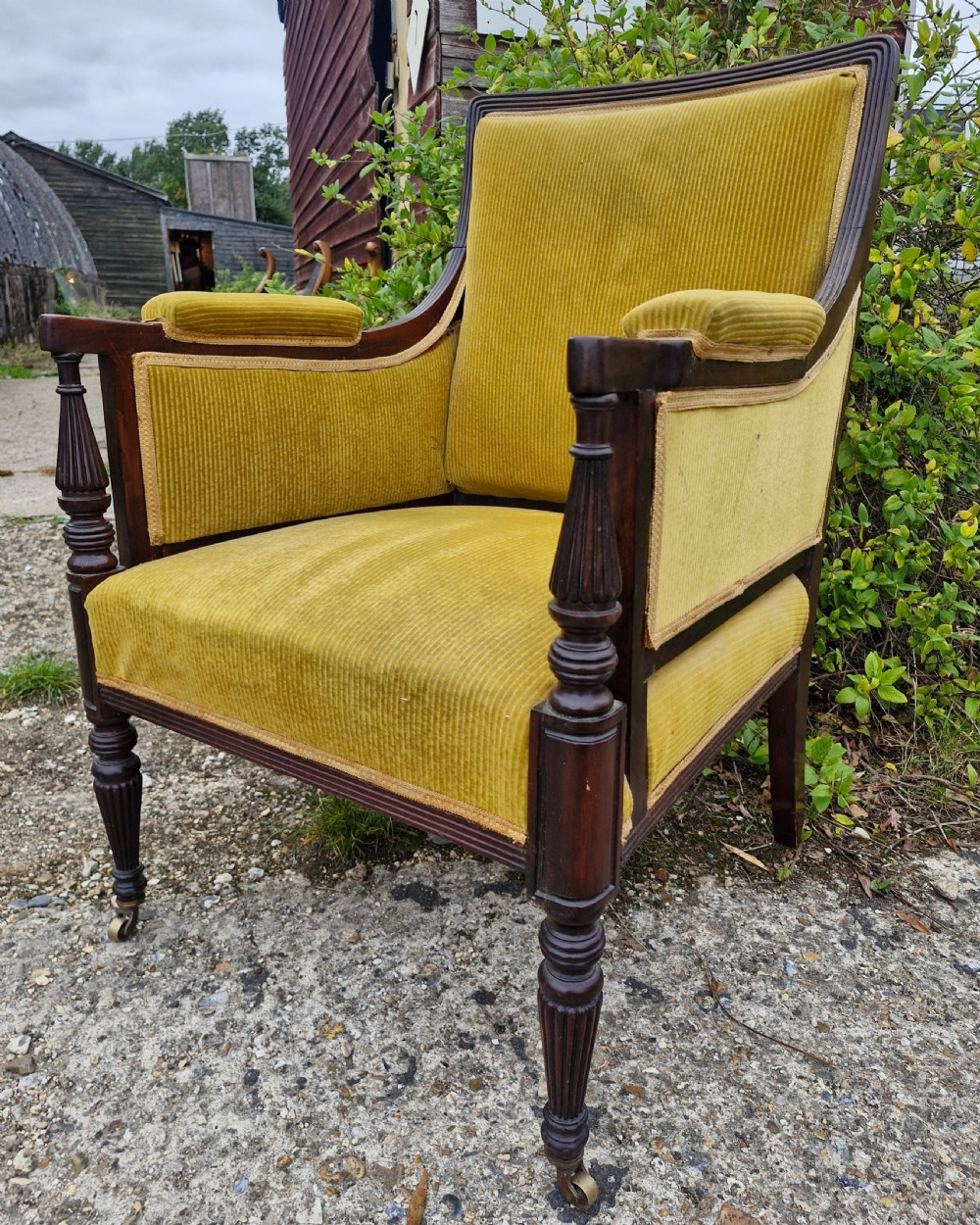 Late Victorian upholstered mahogany framed armchair in the Gillows manner. 