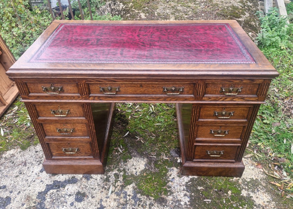 Oak kneehole pedestal writing desk 