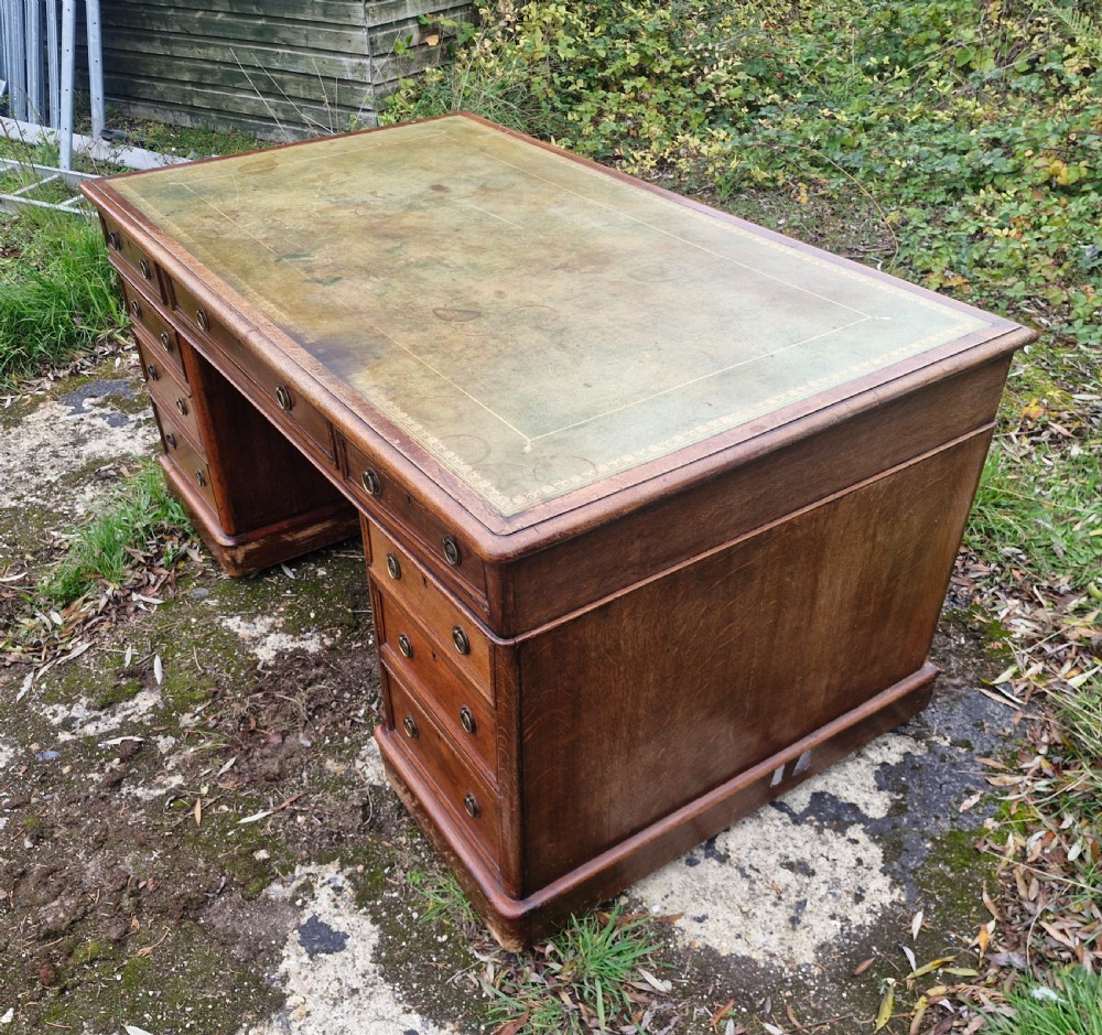 Large Victorian oak kneehole pedestal writing desk.  View III