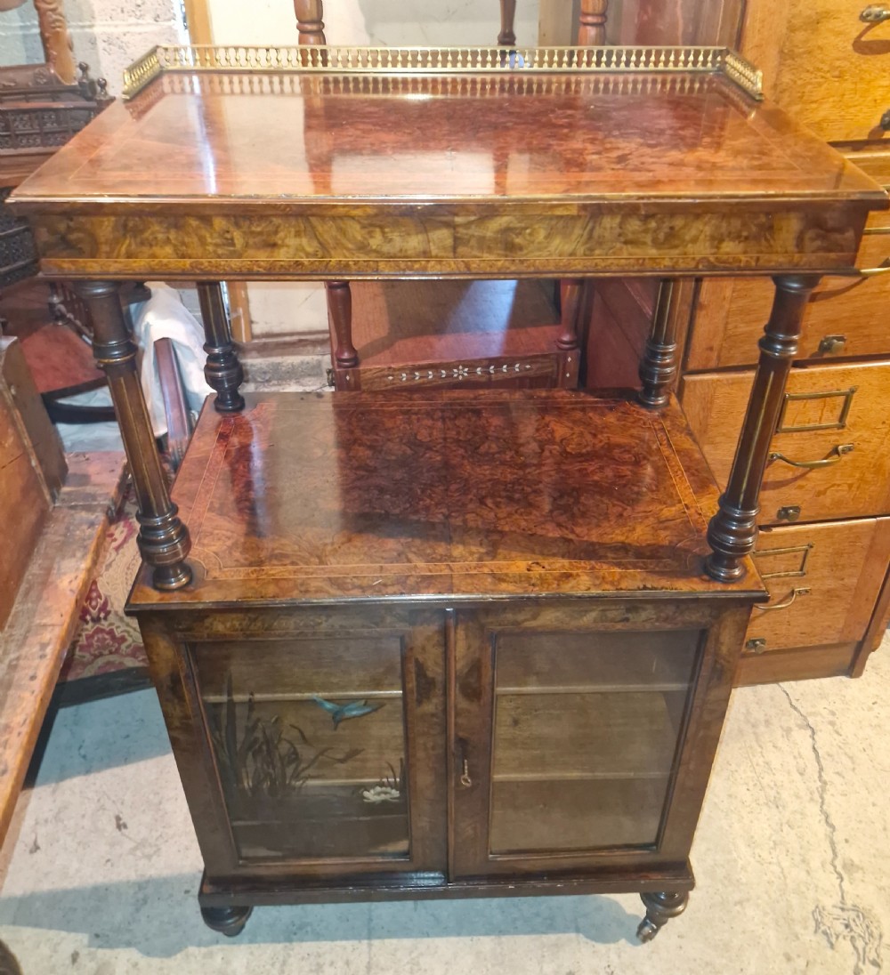 Good quality walnut music cabinet with a lift up adjustable stand .
