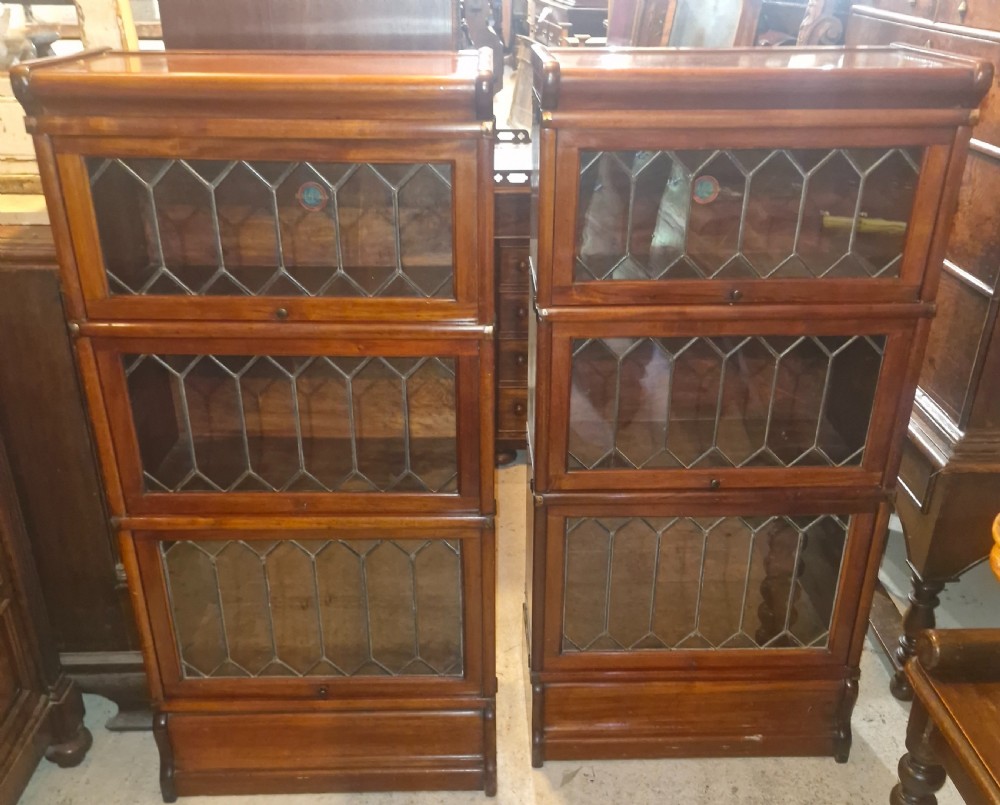 Pair of Dinky mahogany Leaded glazed Globe Wernicke bookcase cabinets.