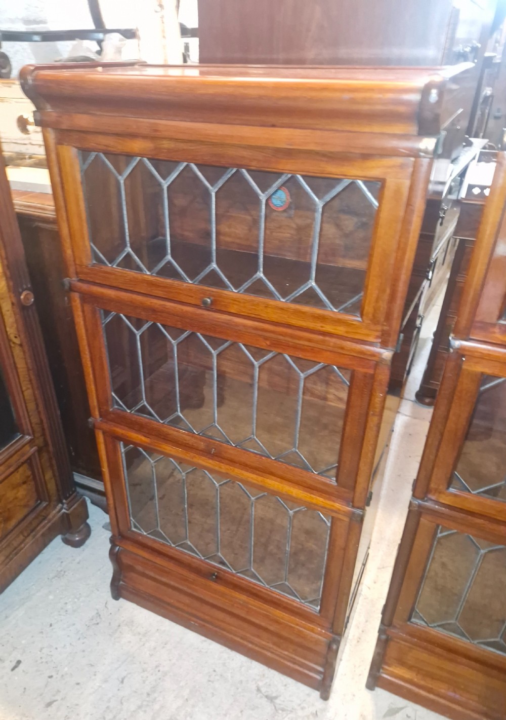 Pair of Dinky mahogany Leaded glazed Globe Wernicke bookcase cabinets. View II
