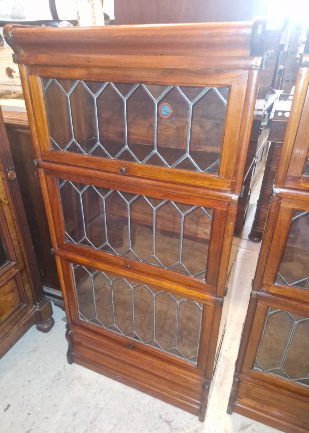 Pair of Dinky mahogany Leaded glazed Globe Wernicke bookcase cabinets. View VI
