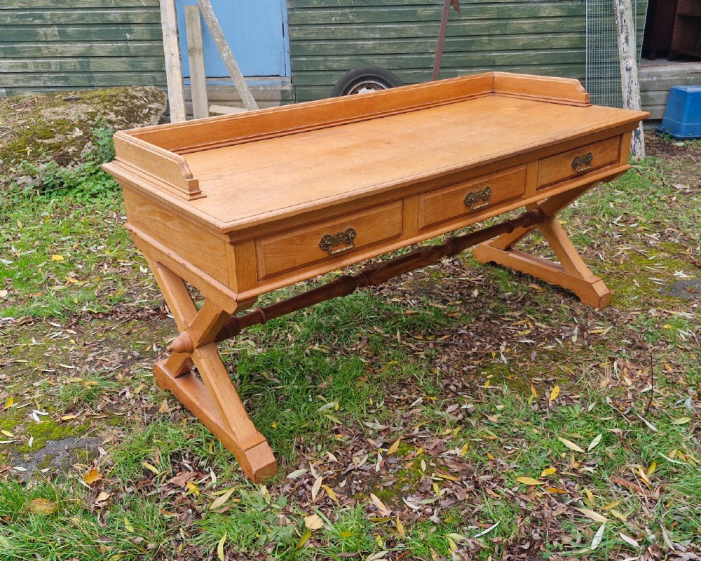 Large oak Gothic revival 3 drawer hall table.
