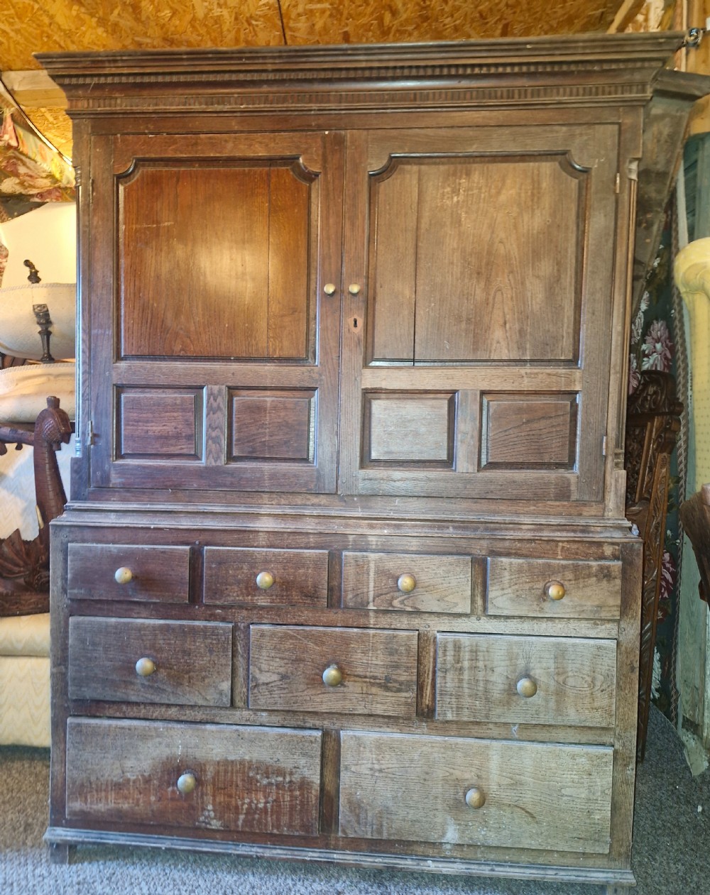 Regency oak Welsh press hall cupboard with original hooks. 