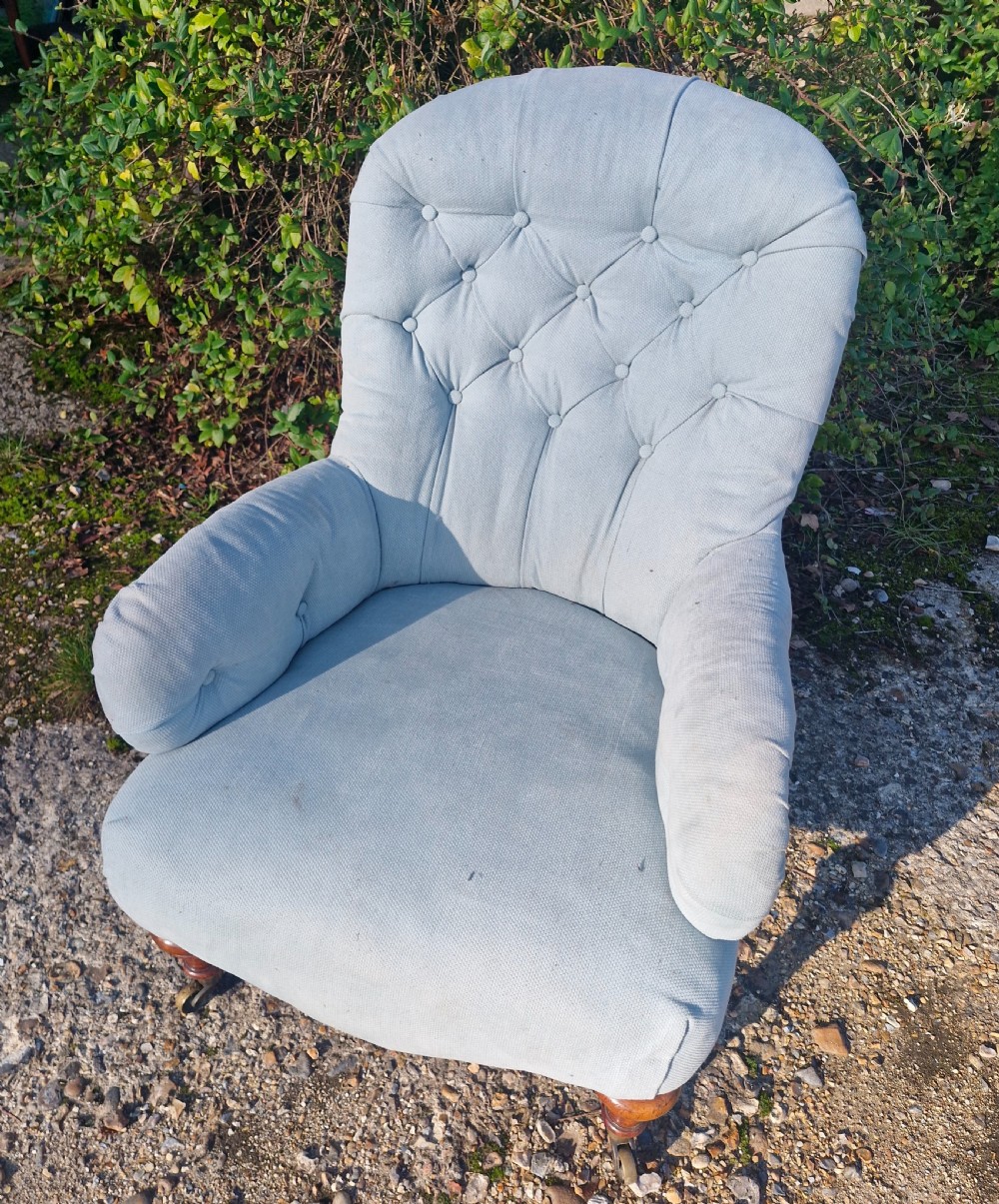 Victorian upholstered bedroom chair on walnut legs and castors.  View V
