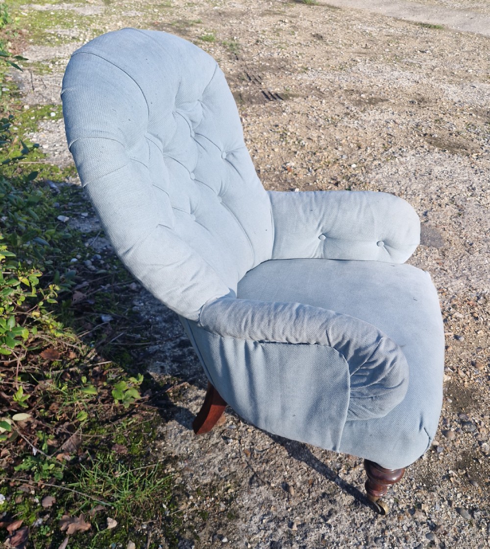 Victorian upholstered bedroom chair on walnut legs and castors.  View VI
