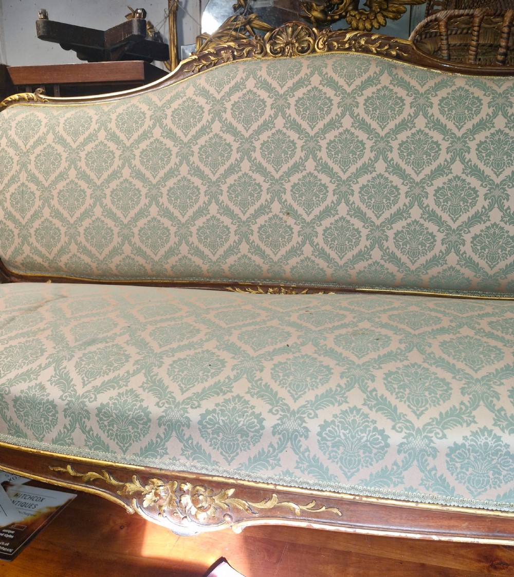 Carved and gilt heightened open arm sofa. View III