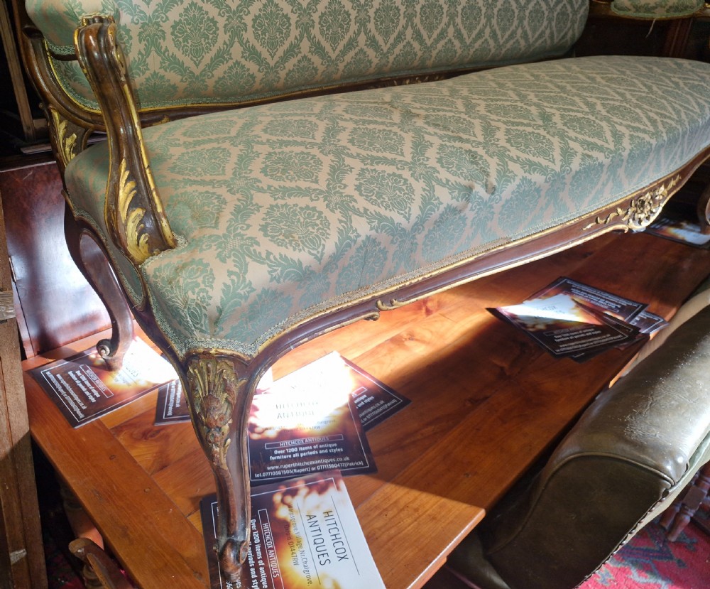 Carved and gilt heightened open arm sofa. View VI