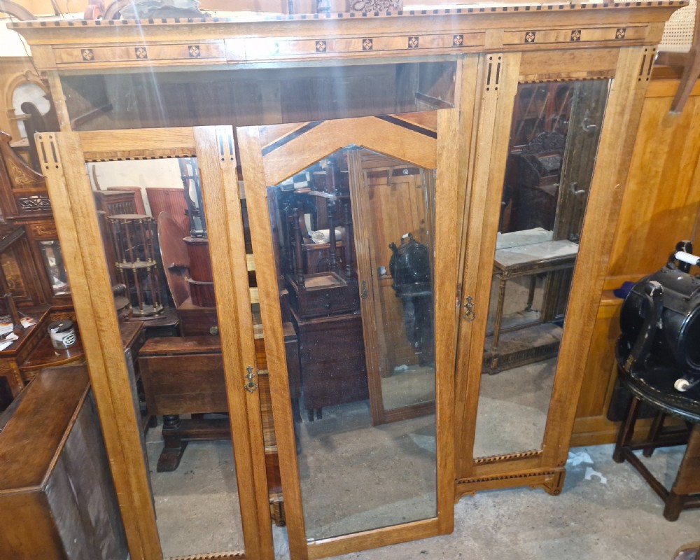 Victorian inlaid oak triple mirror door wardrobe in the manner of Charles Bevan. View VII