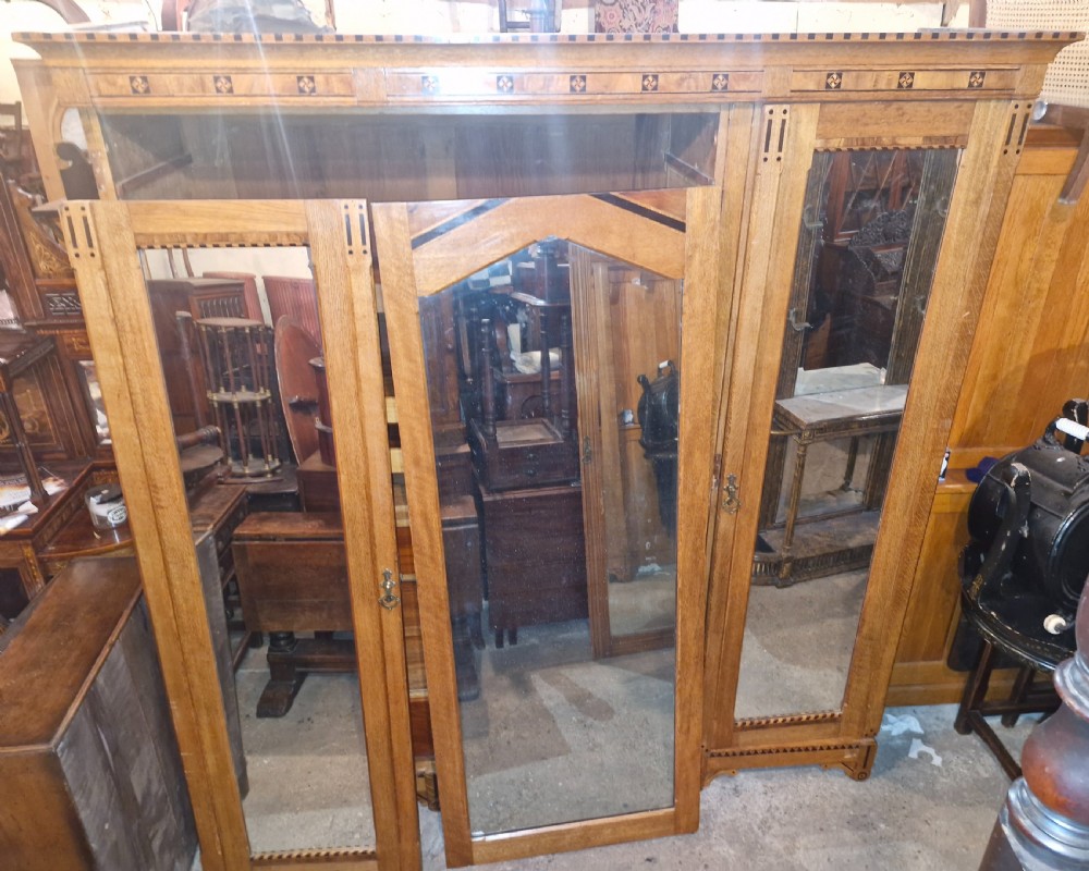Victorian inlaid oak triple mirror door wardrobe in the manner of Charles Bevan. View VIII