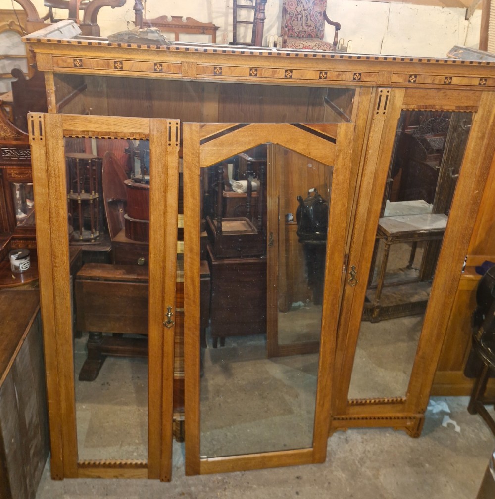 Victorian inlaid oak triple mirror door wardrobe in the manner of Charles Bevan. View IX