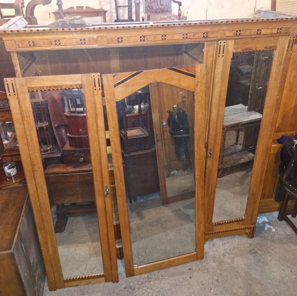 Victorian inlaid oak triple mirror door wardrobe in the manner of Charles Bevan. View X