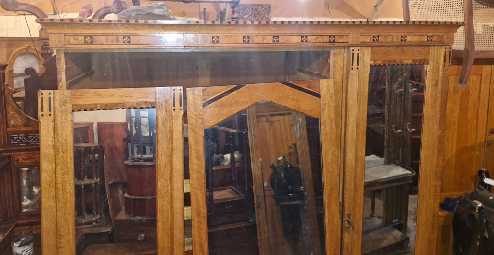 Victorian inlaid oak triple mirror door wardrobe in the manner of Charles Bevan. View XI