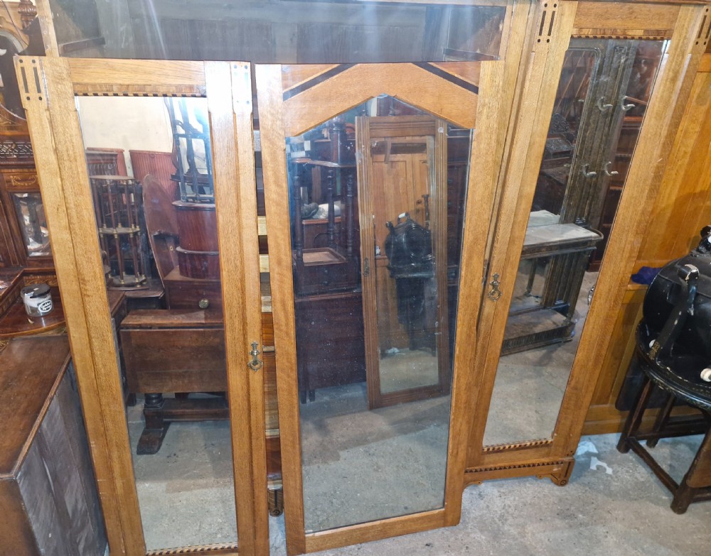Victorian inlaid oak triple mirror door wardrobe in the manner of Charles Bevan. View XIV