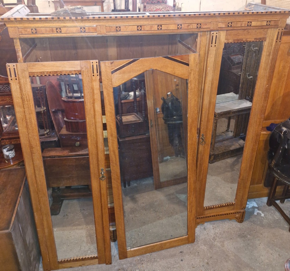 Victorian inlaid oak triple mirror door wardrobe in the manner of Charles Bevan. View XVIII