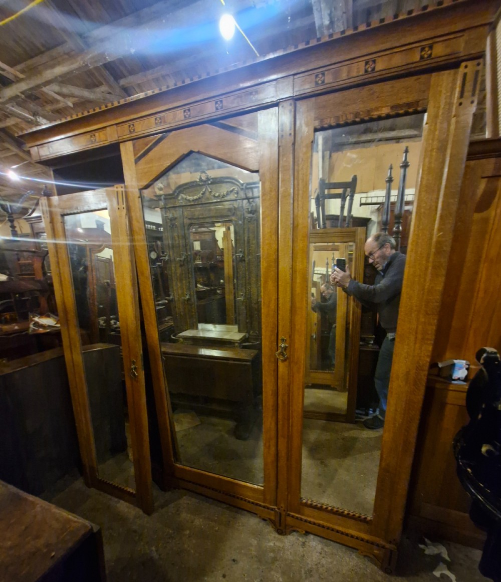 Victorian inlaid oak triple mirror door wardrobe in the manner of Charles Bevan. View XIX