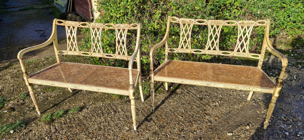 Pair of country house decorated cane seat sofa window seats.