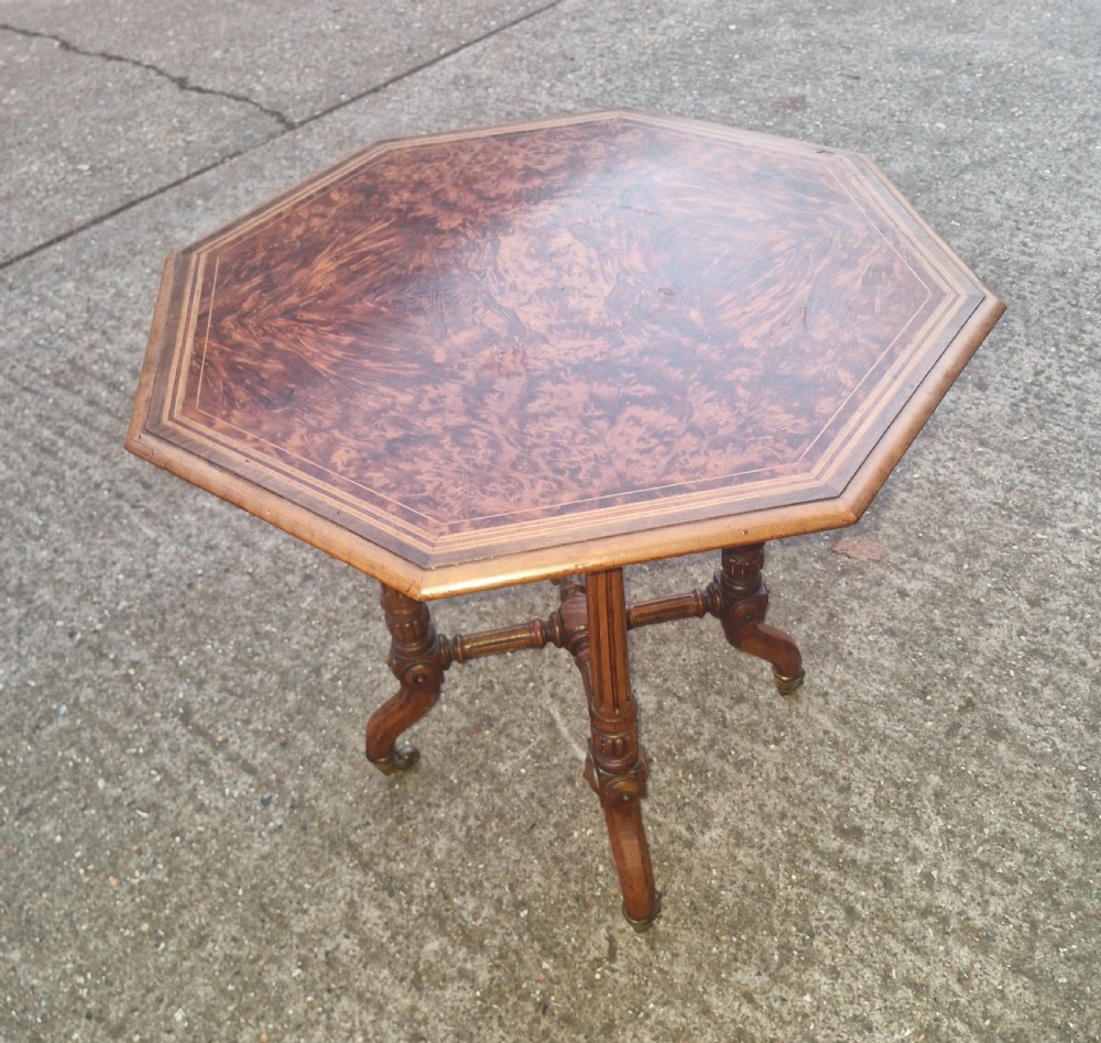 Late Victorian occasional table following a Gillows design .