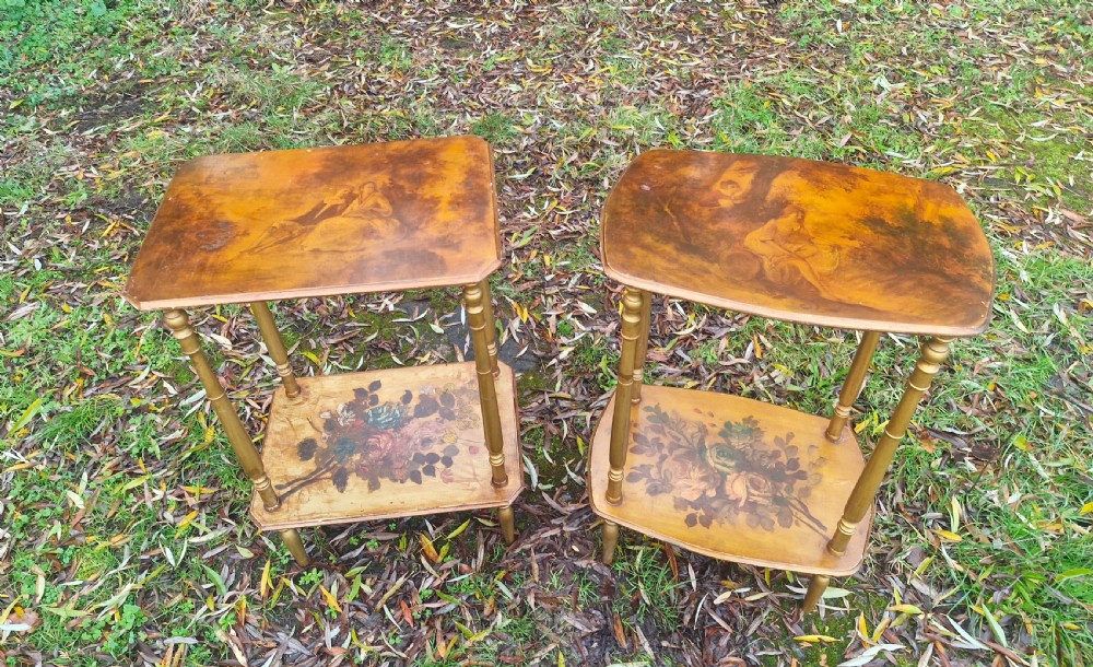 A pair of two-tier rectangular occasional tables featuring gold-painted turned legs, painted figurative scenes on the top surfaces, and floral artwork on the lower shelves. View IX