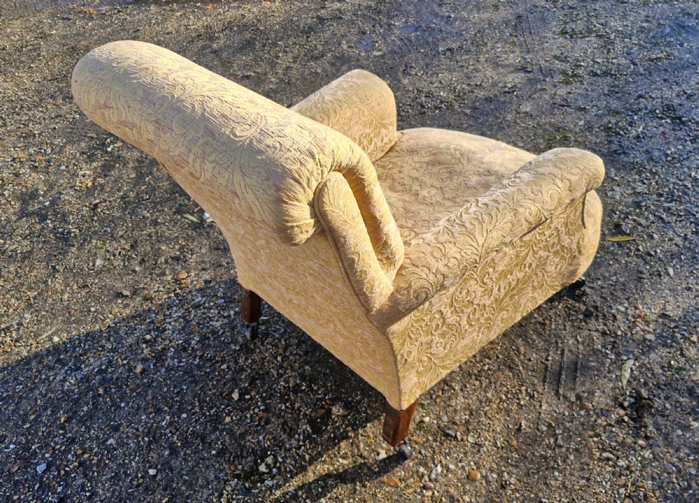 Late Victorian upholstered armchair in the style of Howard.  View II