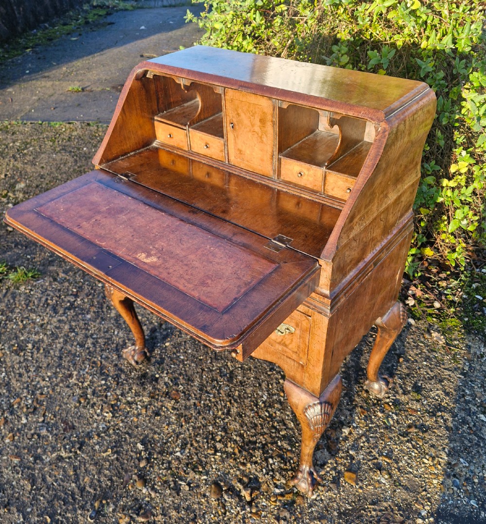 Small early 20th century walnut Queen Anne style bureau. 