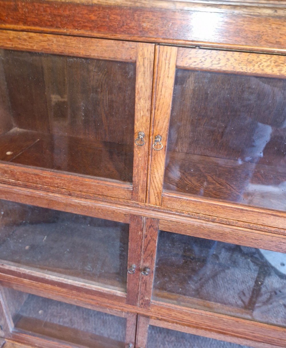 Oak 4 section Sectional glazed bookcase cabinet.  View V