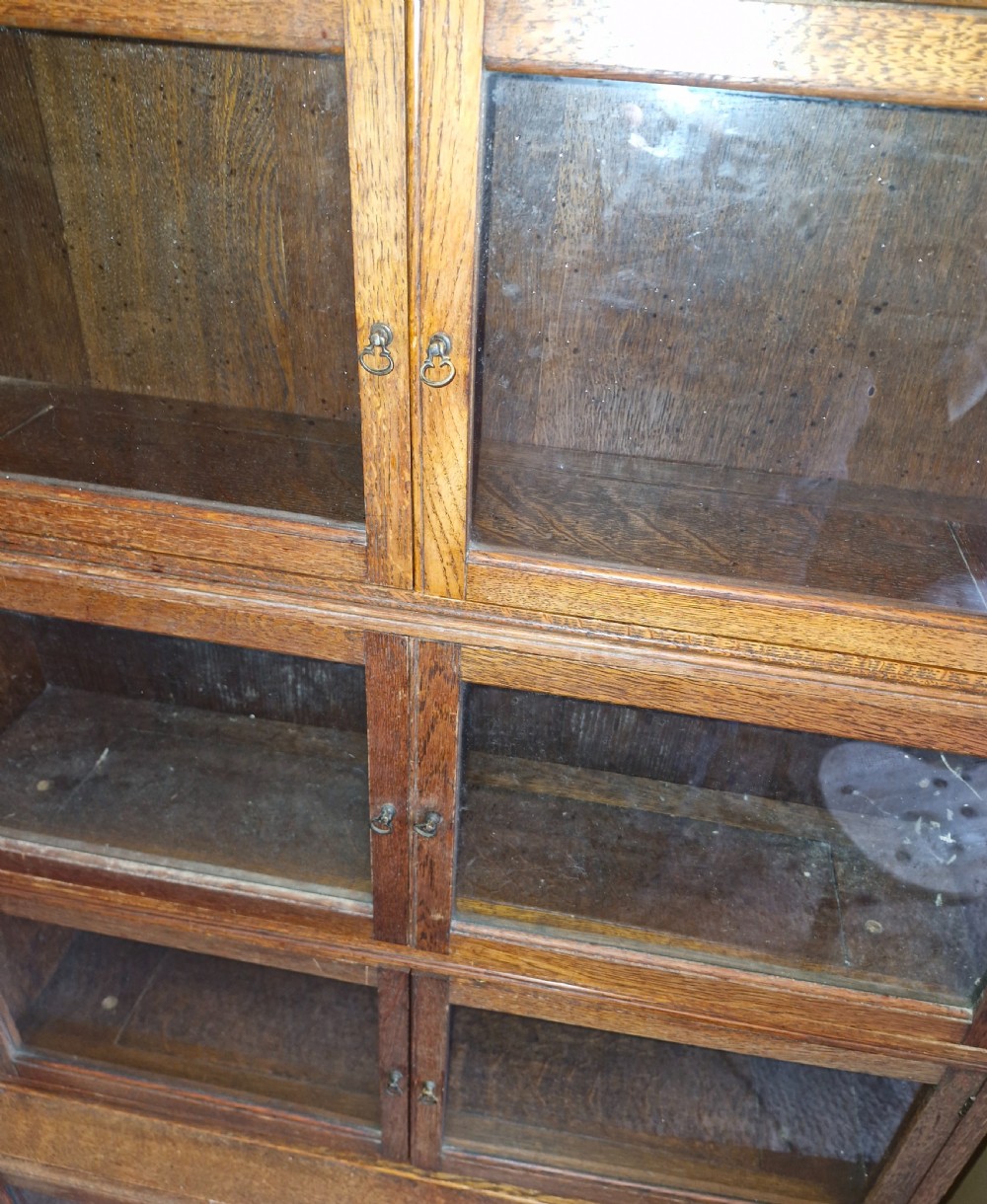 Oak 4 section Sectional glazed bookcase cabinet.  View VI