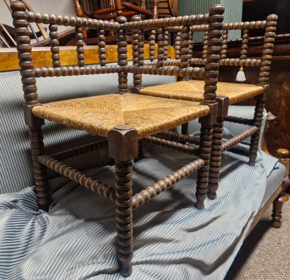Pair of Bobbin framed rush seat corner chairs. View V