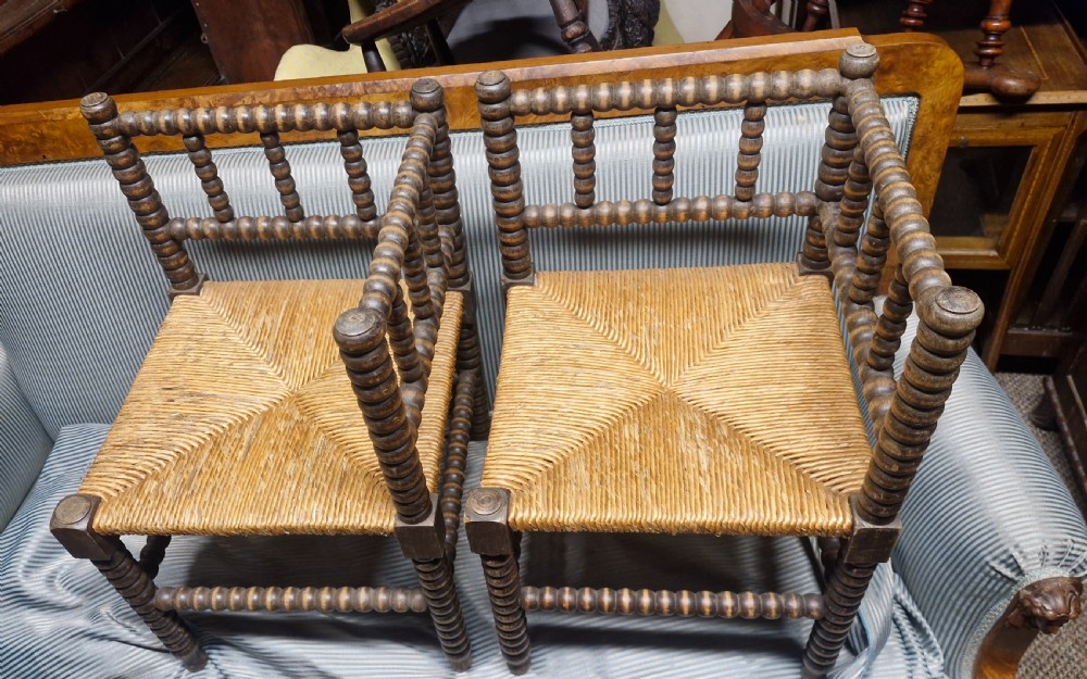Pair of Bobbin framed rush seat corner chairs. View X
