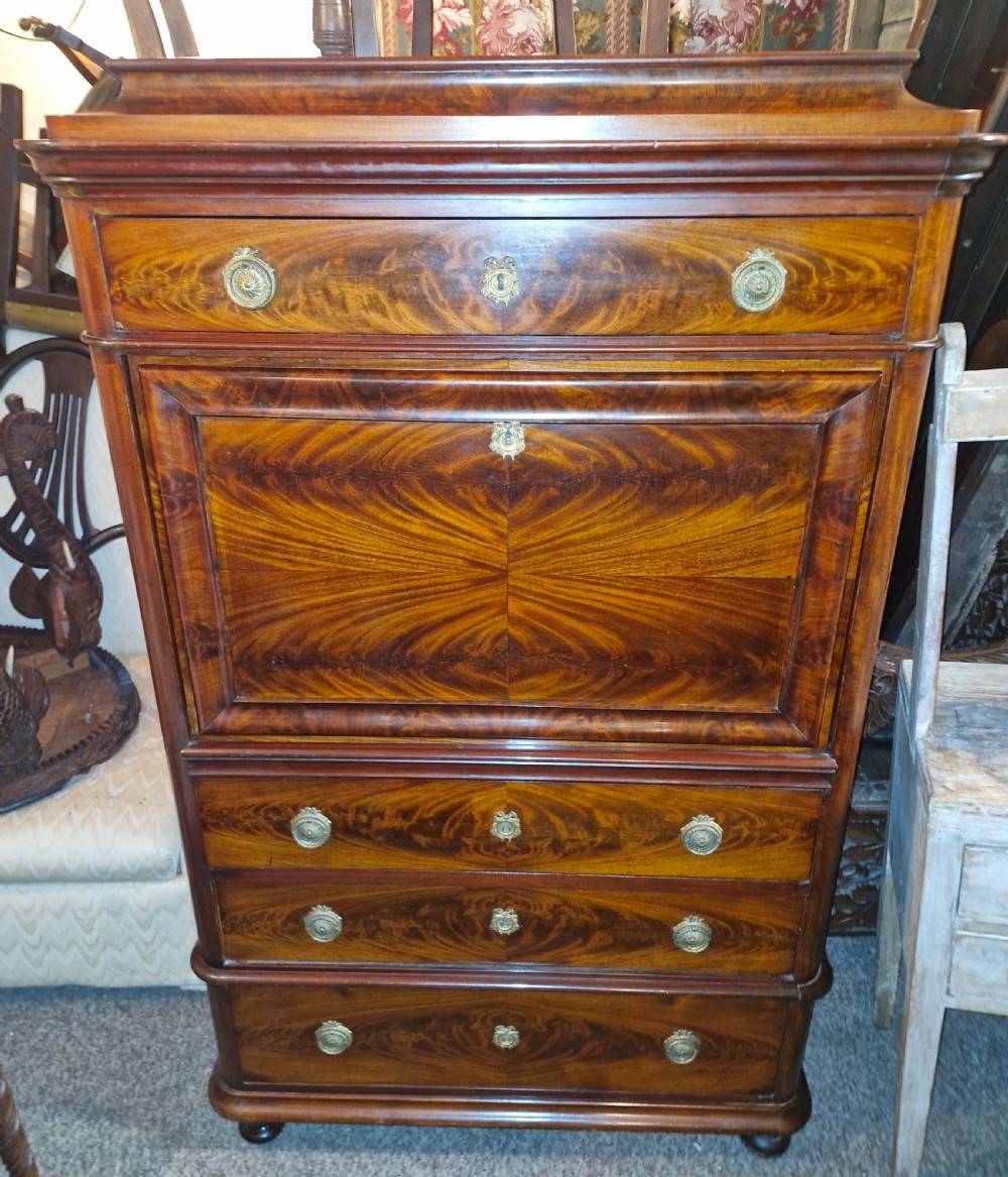 A 19th-century mahogany fall-front escritoire featuring flame mahogany veneer panels, a drop-down writing surface, multiple storage drawers, and brass fittings. View XI