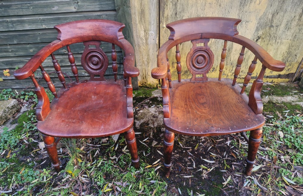 Pair of Victorian Bulls Eye Smokers bow armchairs.