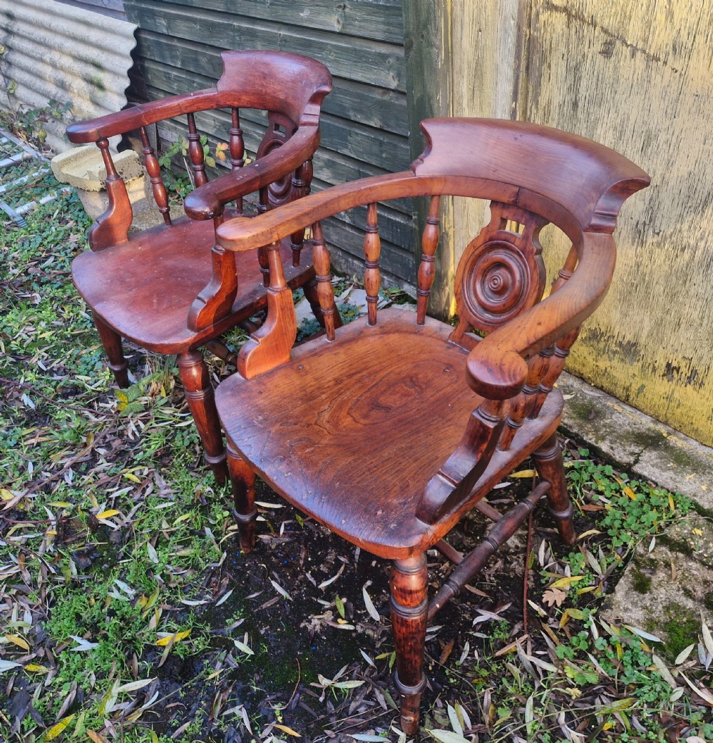 Pair of Victorian Bulls Eye Smokers bow armchairs. View II