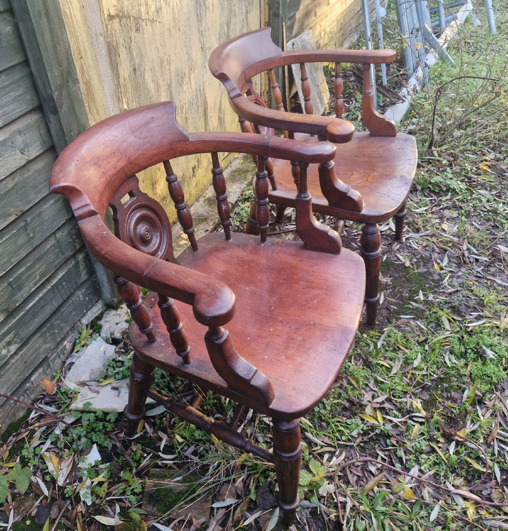 Pair of Victorian Bulls Eye Smokers bow armchairs. View V